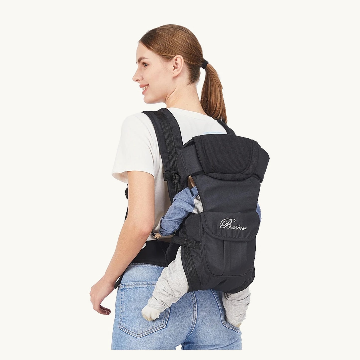 Mother carrying a baby on her back in the CarryCloud carrier