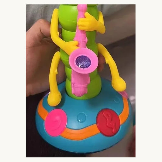WiggleBug dancing caterpillar toy in green with saxophone