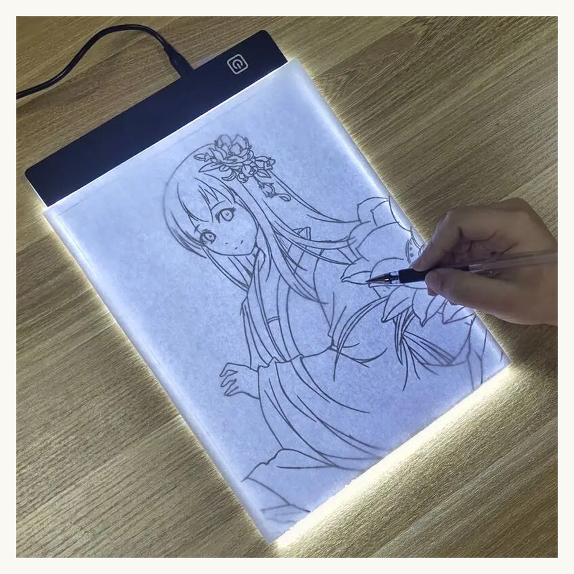 Tracing a drawing on the glowing GlowTrace LED pad