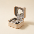 Open travel jewellery case showing velvet interior and mirror