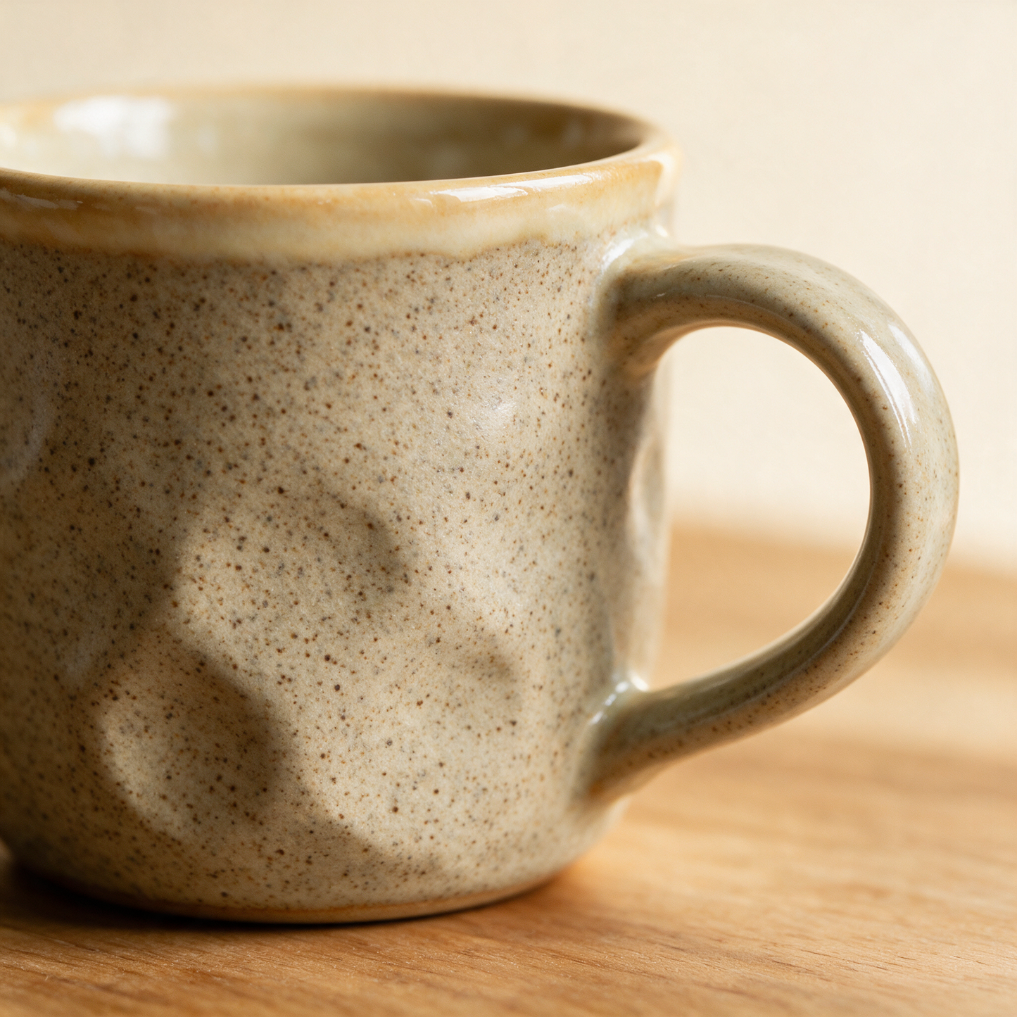 Close-up of The Daily stoneware mug speckled glaze and handle