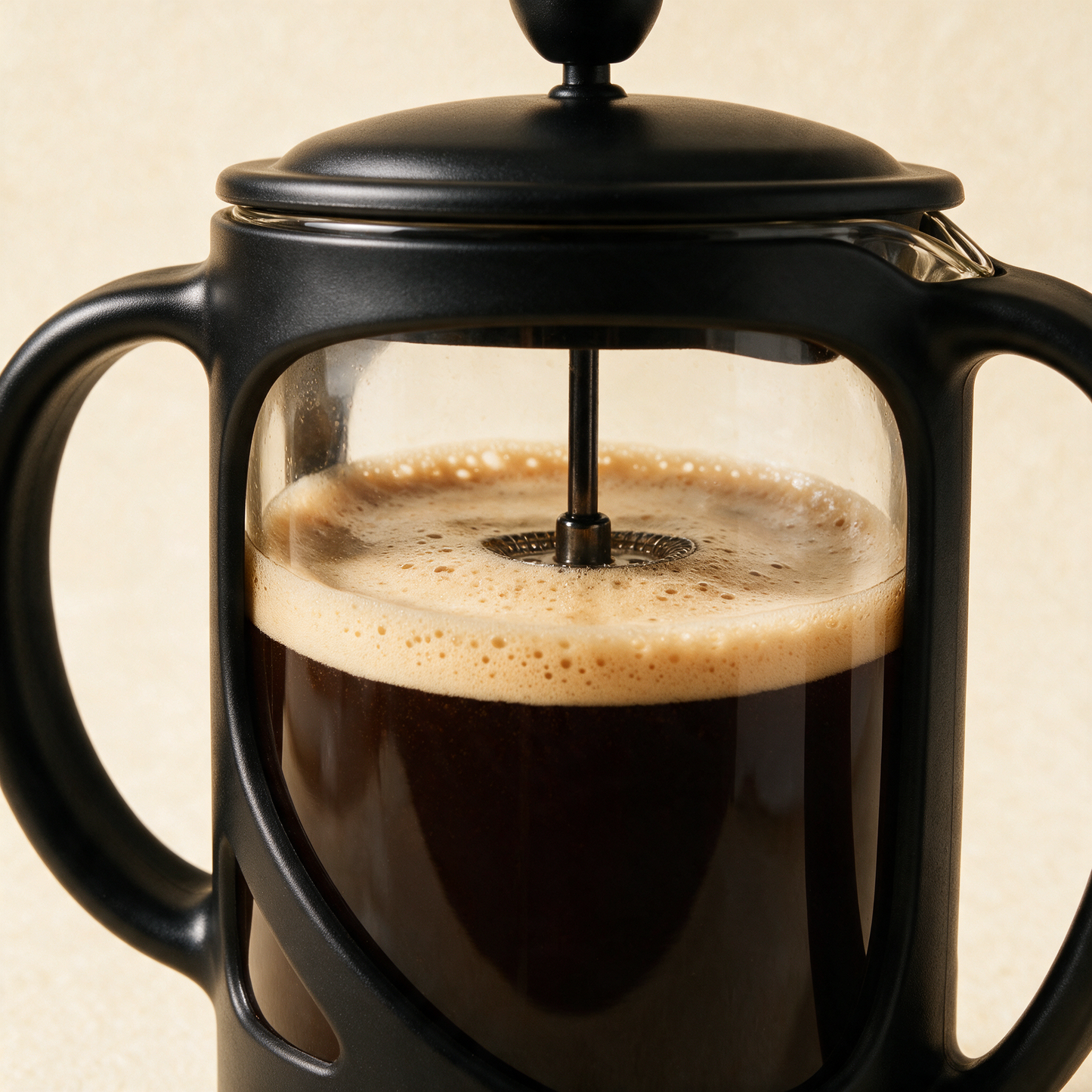 Close-up of The Press black frame, lid and plunger knob with fresh coffee