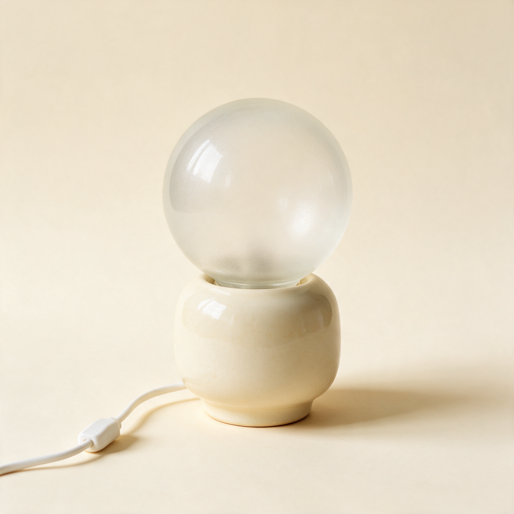 The Bedside touch lamp unlit at an angle showing globe and base