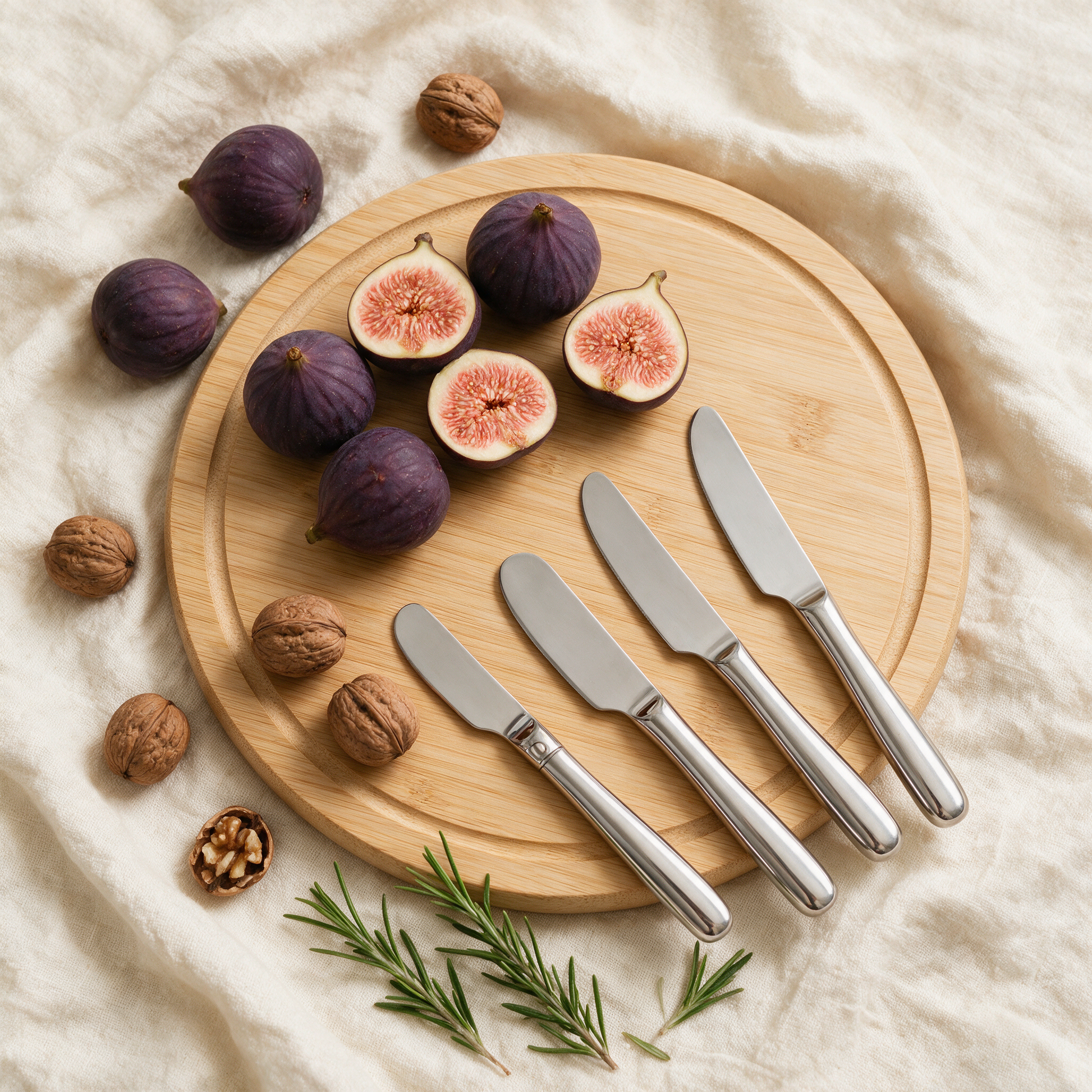 The Grazer flat lay with stainless knives, figs, walnuts and rosemary