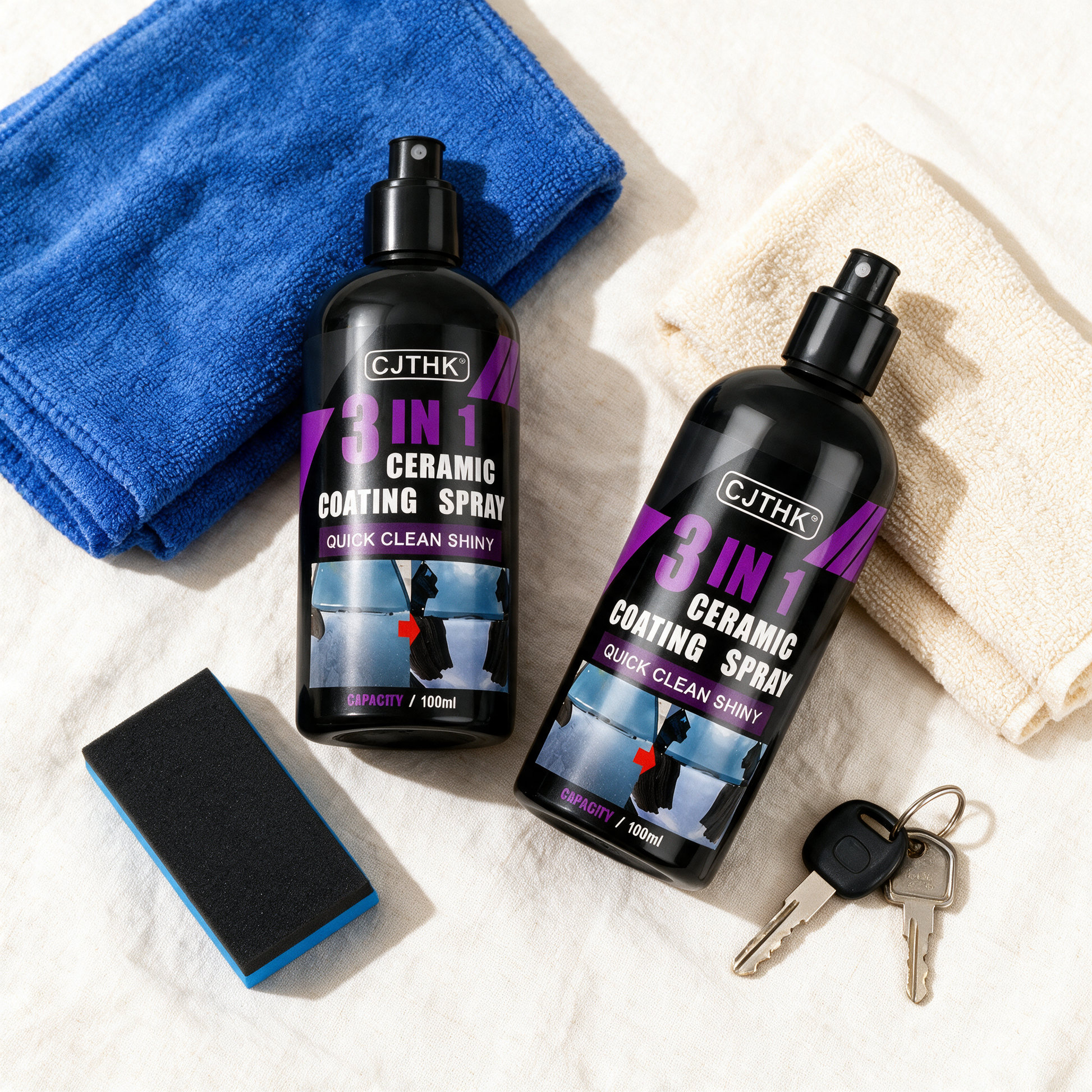 GlossGuard kit flat lay with two bottles, cloths, applicator and car keys