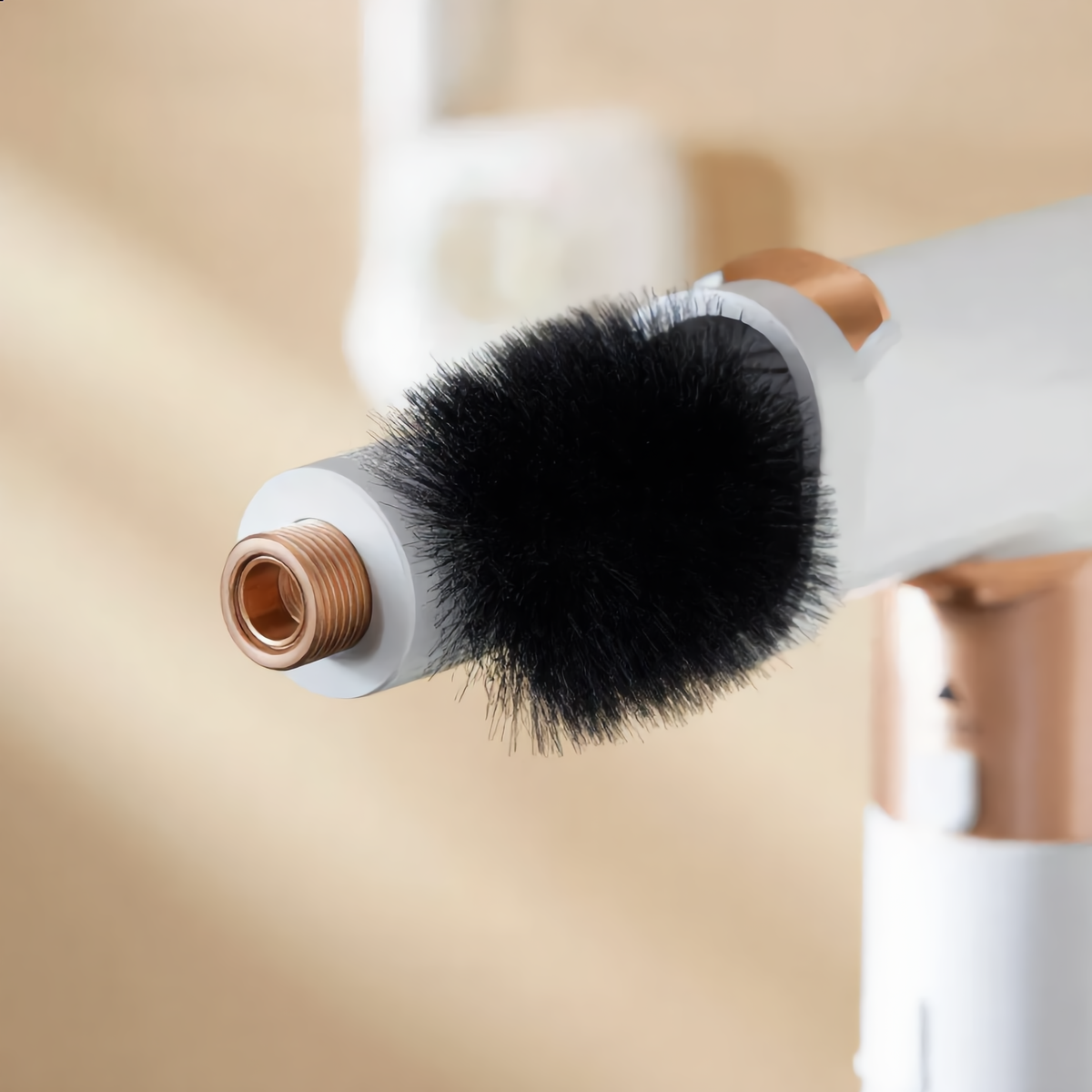 Close-up of the round volumising brush attachment