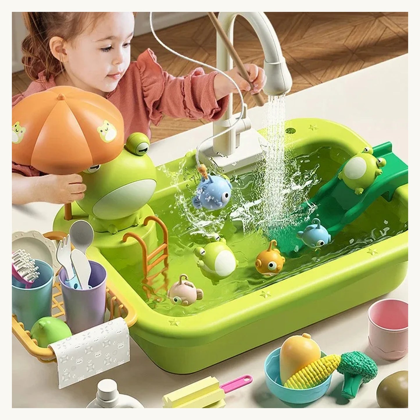 Girl playing with the SplashChef duck play kitchen sink with running water