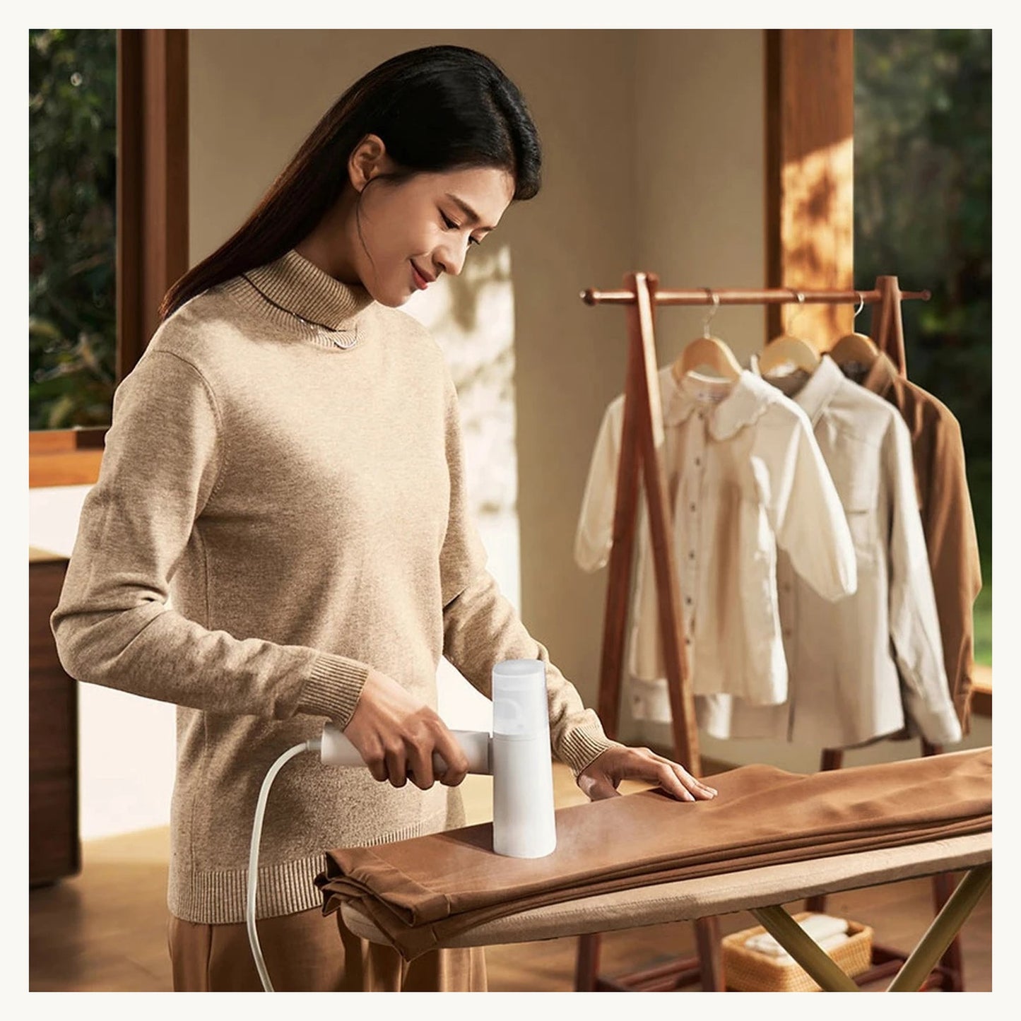 Steaming a hanging shirt with the SteamEase handheld steamer