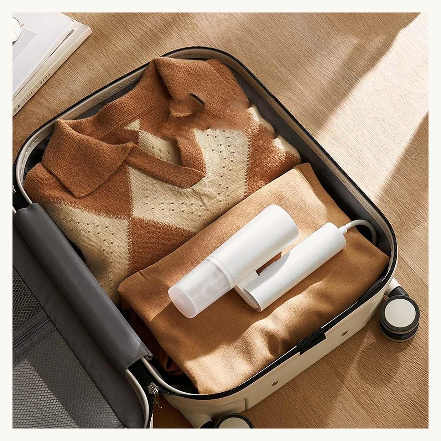 SteamEase steamer packed in a suitcase for travel